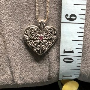 Vintage circa 1950 filigree silver heart with garnet stone